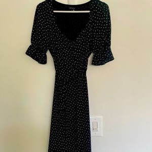 Flattering black and white polka dot dress